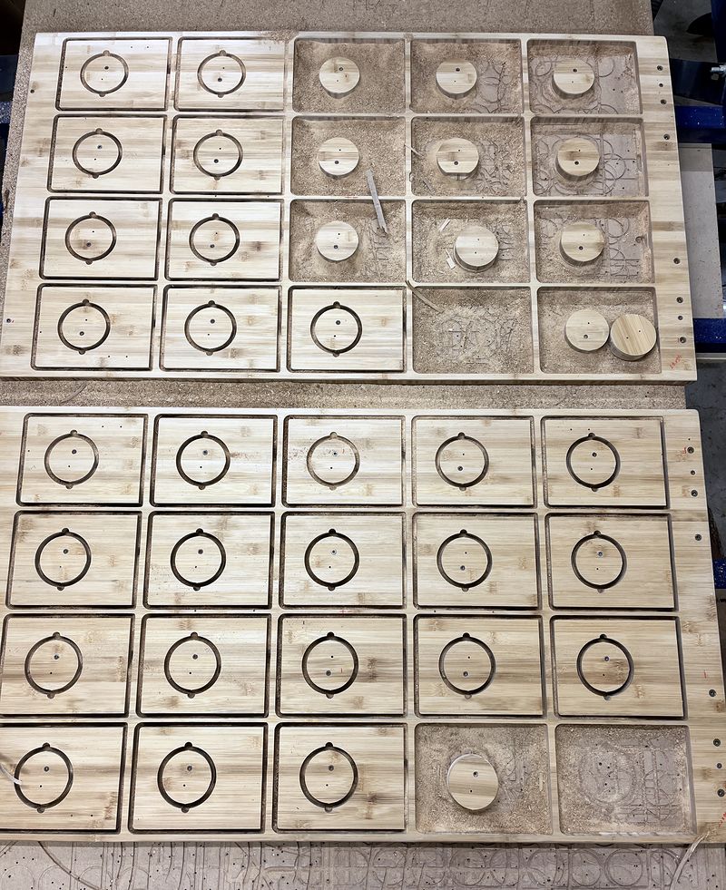 Clock parts nested on a sheet for a production run