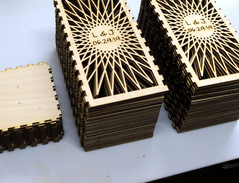 Laser-cut plywood wedding centerpiece boxes
